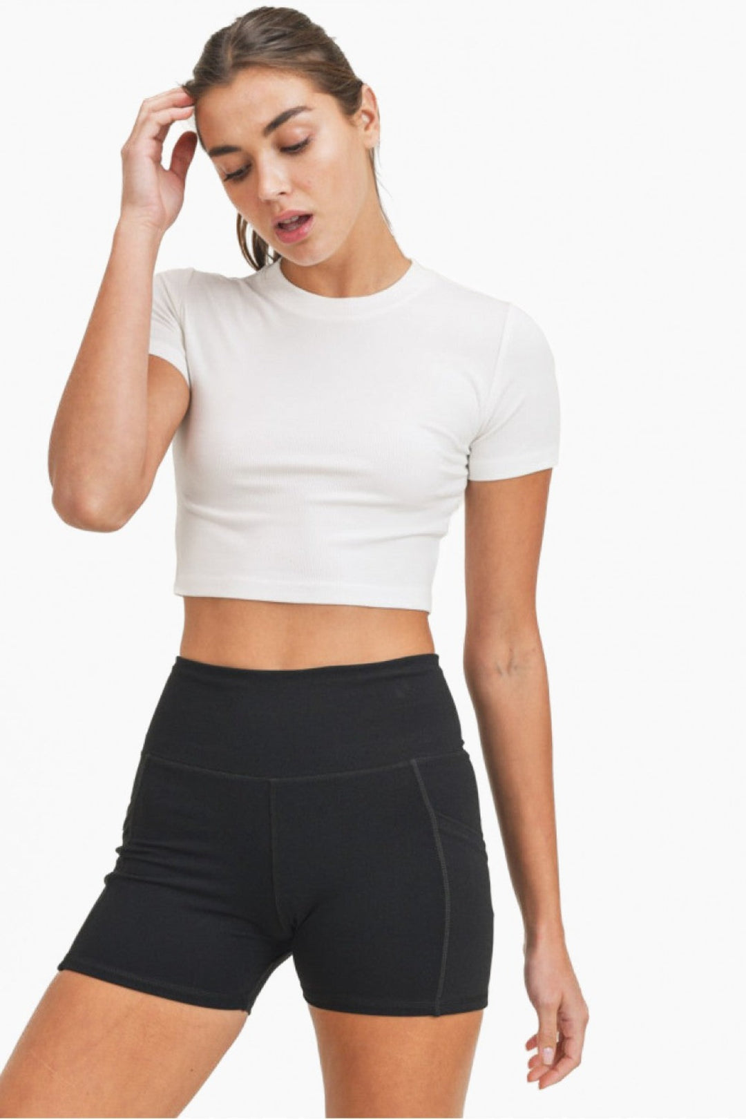 Whether as a workout top (worn over a sports bra and a pair of leggings) or as a cute top (matched with a denim item), this cropped tee is as versatile as it is comfortable. It has short sleeves, a rounded neckline, and a form-fitting silhouette.