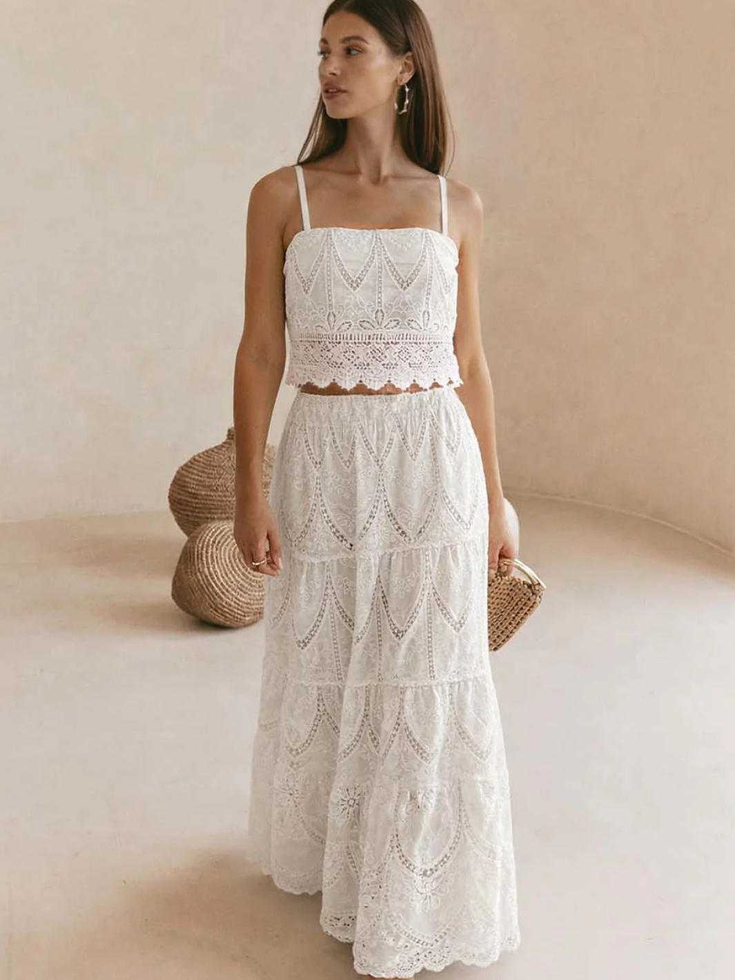 Model wearing Santorini Embroidered Tiered Maxi Skirt with a matching crop top in white lace, boho style.