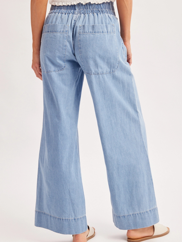 The Sailor Wide-Leg Denim Trouser in light denim, relaxed wide-leg with back pockets and vintage wash.