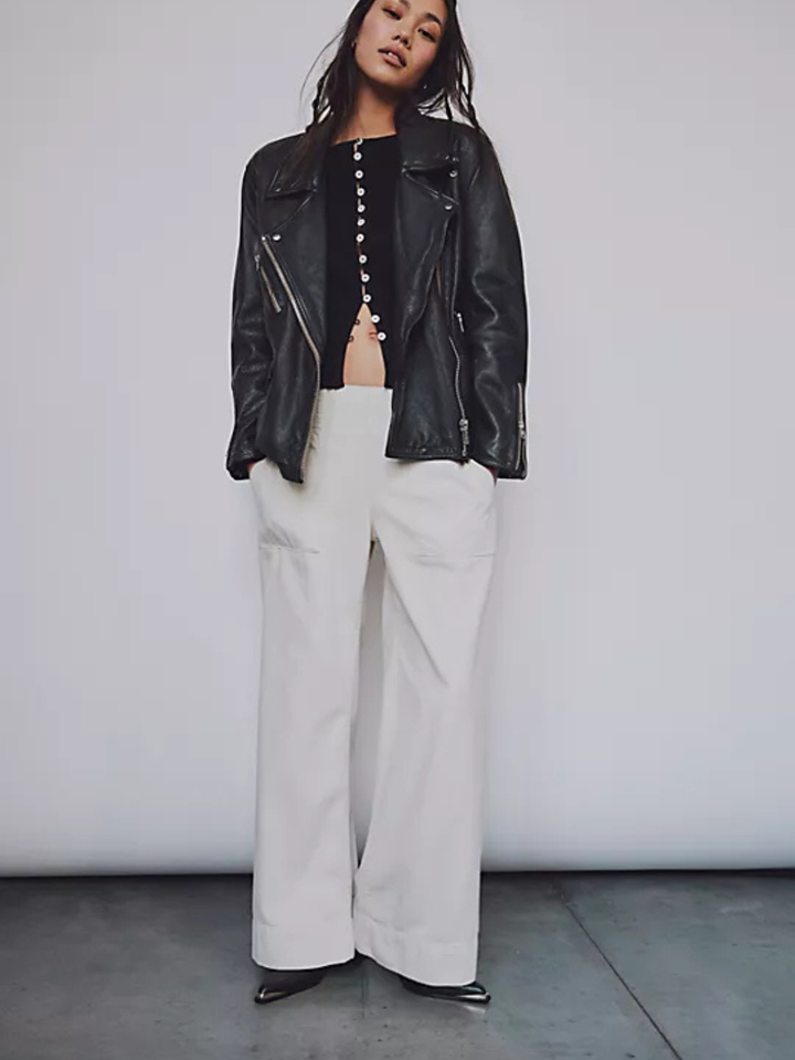 White breezy denim pull-on jeans, mid-rise, wide-leg, paired with black top and leather jacket