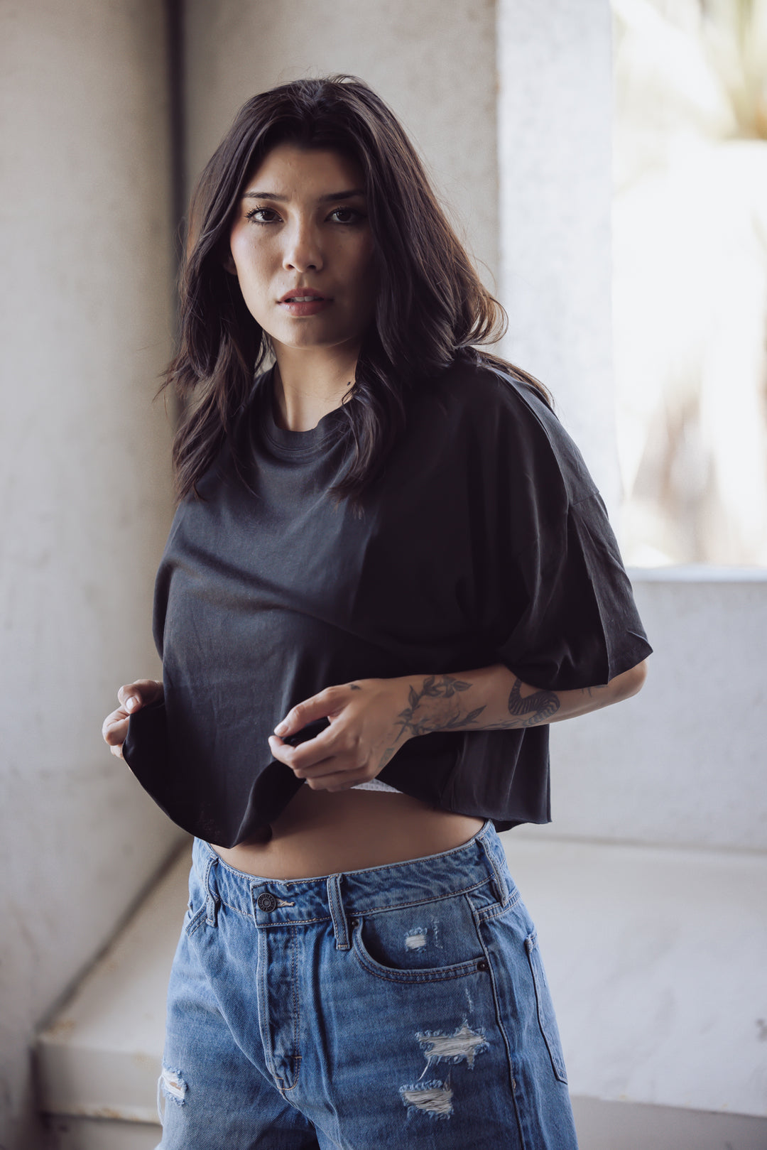 A tried and true classic. This simple tee is made with cotton that is pigment dyed for a rich color and features a raw edge and relaxed cropped fit.