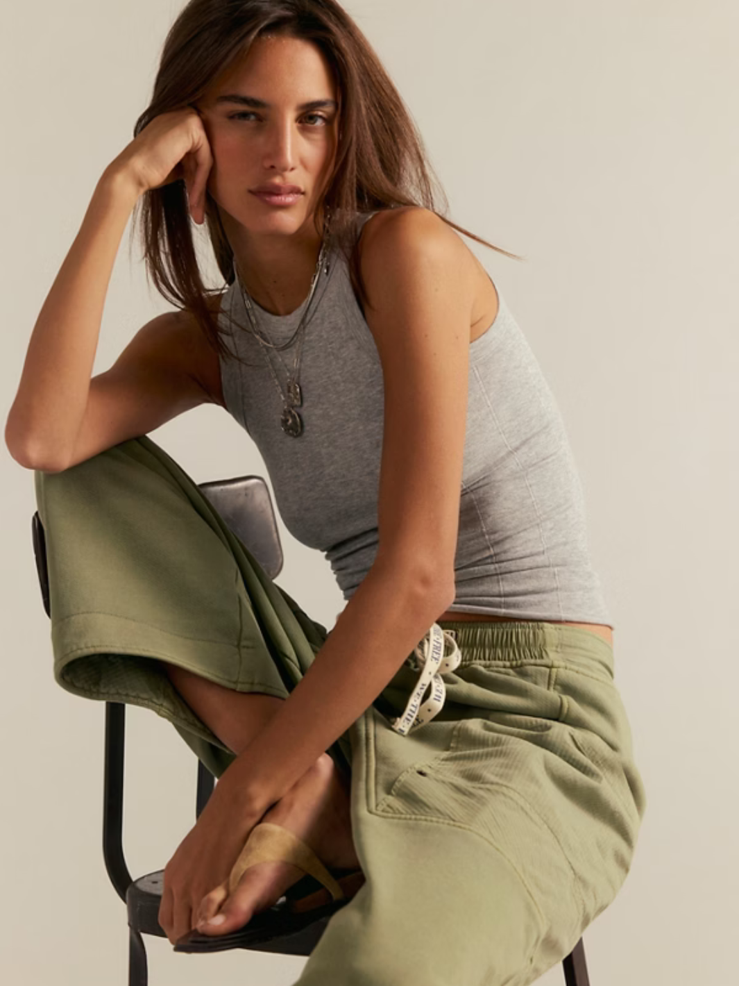 Free People So Soft Seamless Modal Tank on a model; gray sleeveless top with sculpted seams.