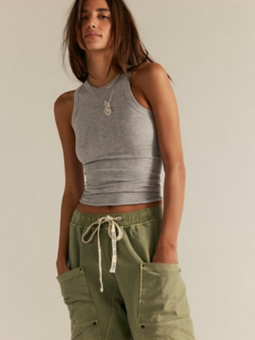 Free People So Soft Seamless Modal Tank in gray, sculpted seam detailing, worn with olive cargo pants.