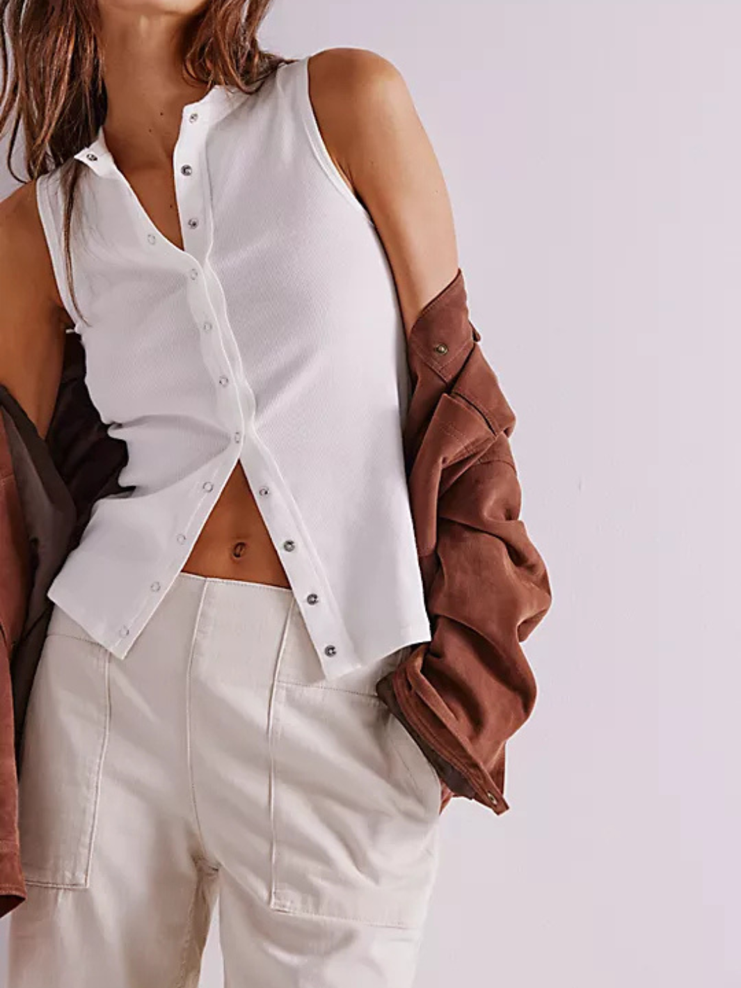 Free People We The Free Breezy Denim Pull-On Jeans on a model wearing a white top and brown jacket.