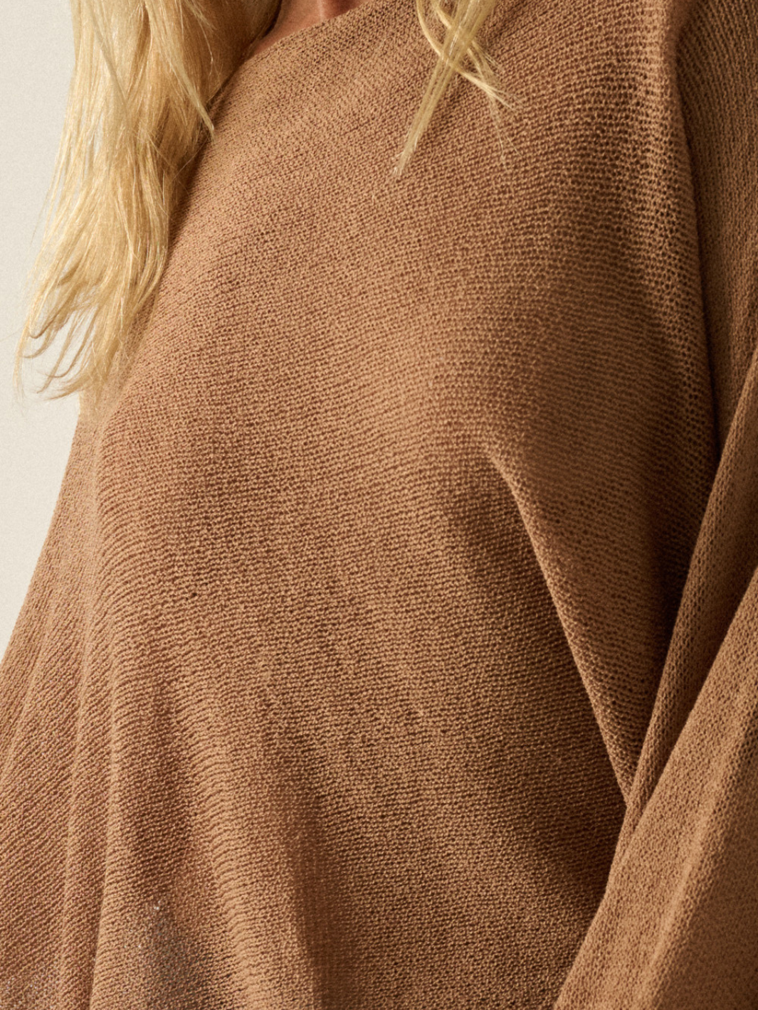 Daydrift Sheer Knit Poncho Sweater fabric in warm tan with airy, oversized drape.