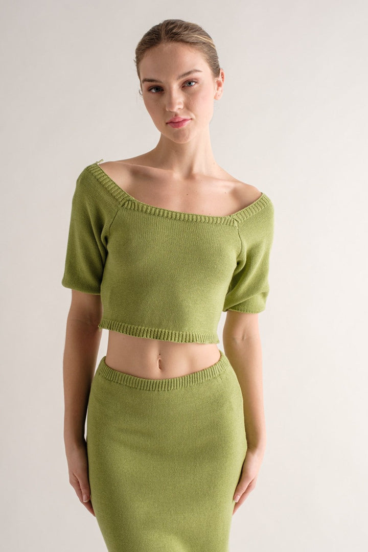 Look stylish and sophisticated in this Logan knitted top. Crafted from 100% cotton, you'll enjoy the easy breathability and comfort of this knit top. The cropped design and square neckline put a modern twist on the classic short sleeve top, perfect for a summer day. Complete the look with a matching set or mix and match with prints and textures.
