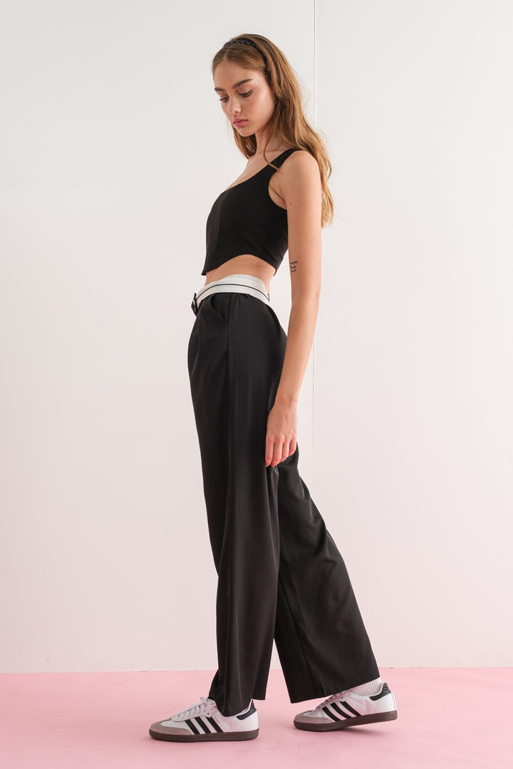 The Diana Wide Leg Pants are designed to provide an effortless, comfortable look. Crafted from a blend of 95% polyester and 5% spandex, these pants boast an elastic waist, high waistline, and two convenient front pockets. The addition of the wide leg allows for more freedom of movement, distinguishing them from traditional skinny leg pants.