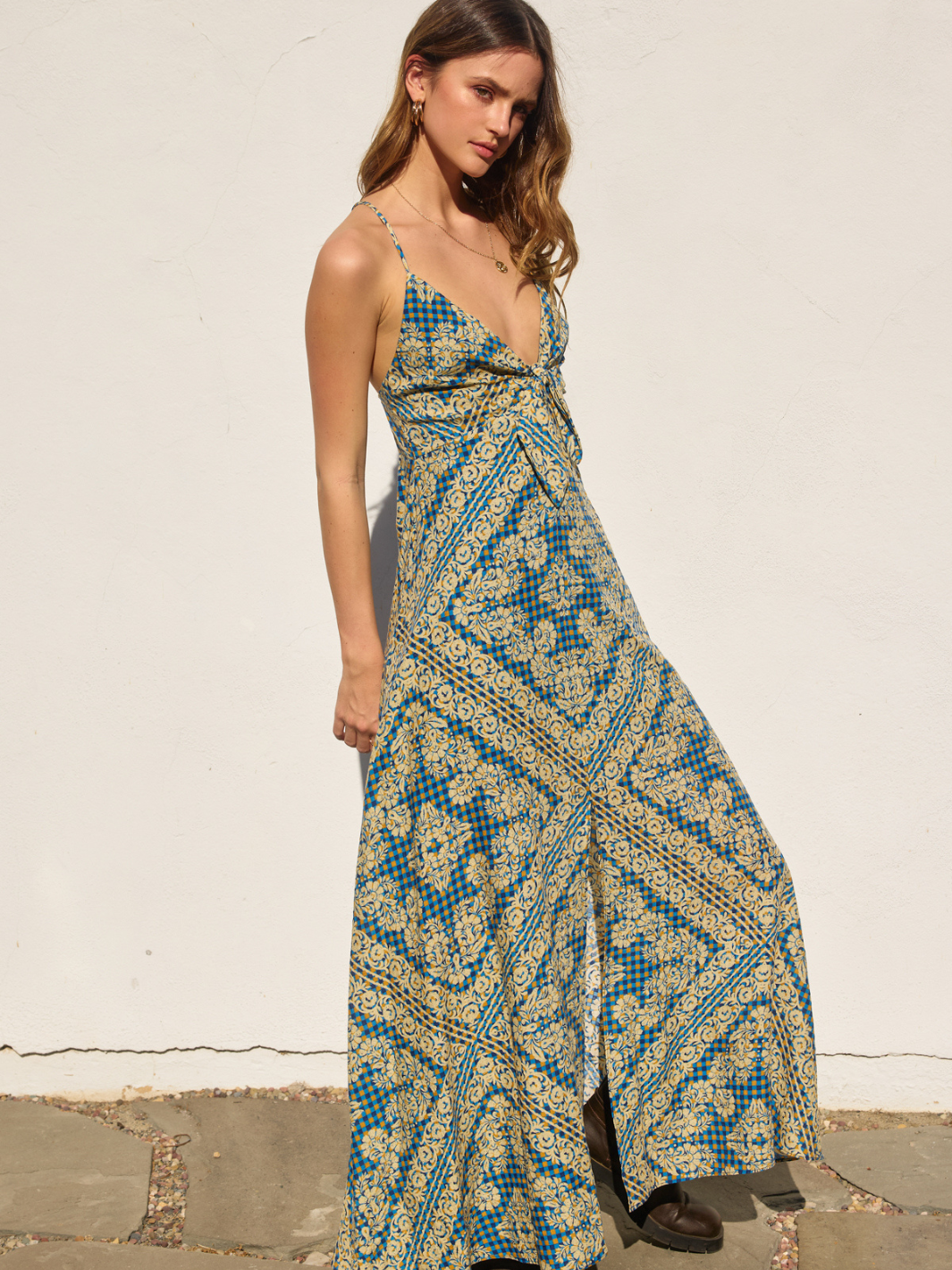 The Lynelle Stay Cute Knot Maxi Dress features a chic knot-front design, perfect for summer days and nights.