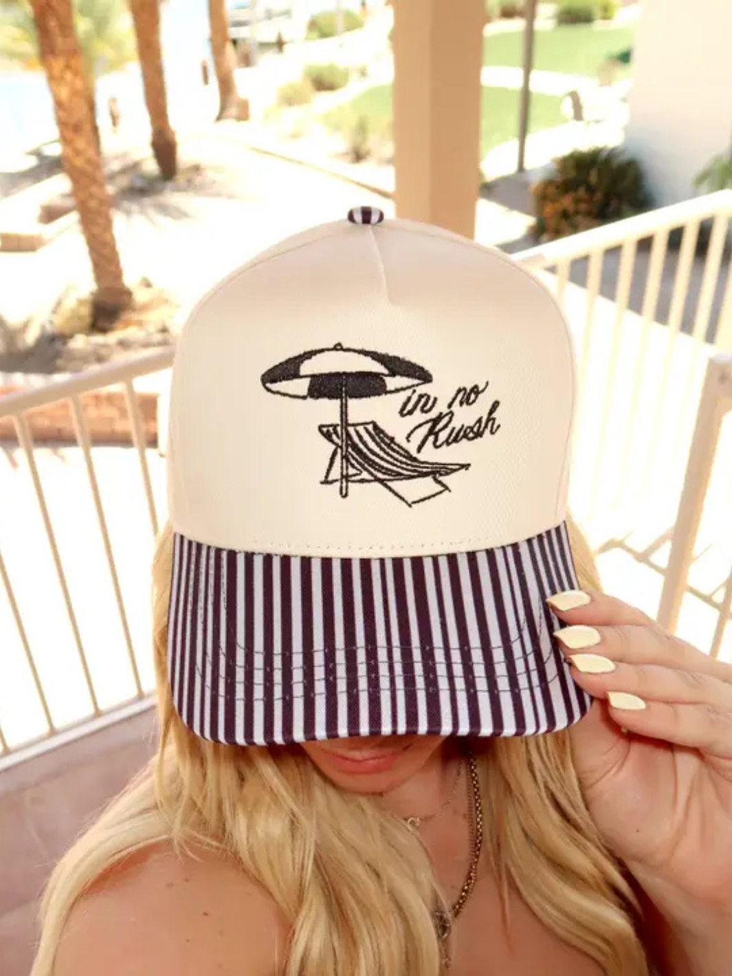 Stylish In No Rush - Black Striped Bill Trucker Hat with Ruby Moon logo, perfect for comfort and outdoor fun.