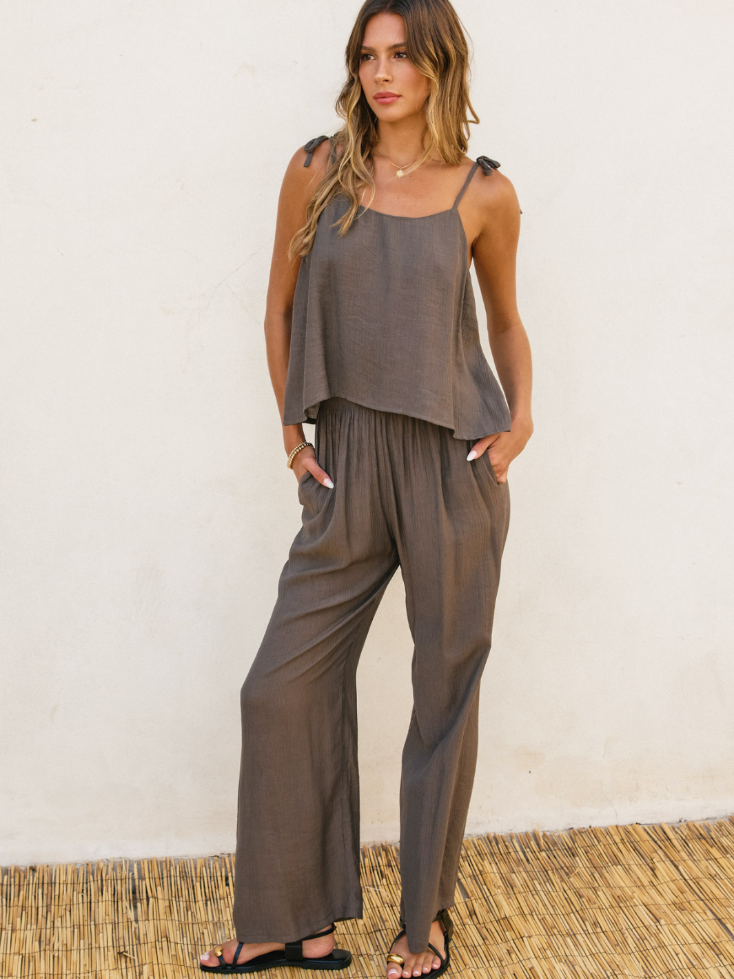 Stylish Level Up Shoulder Tie Up Top paired with relaxed pants, perfect for warm weather comfort and chic looks.