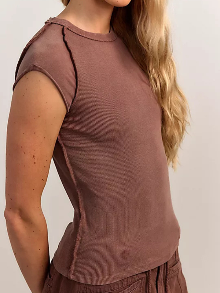 Ever Had Tee by Free People in dusty rose ribbed knit, slim hip-length, raised seams, cap-inspired sleeves.