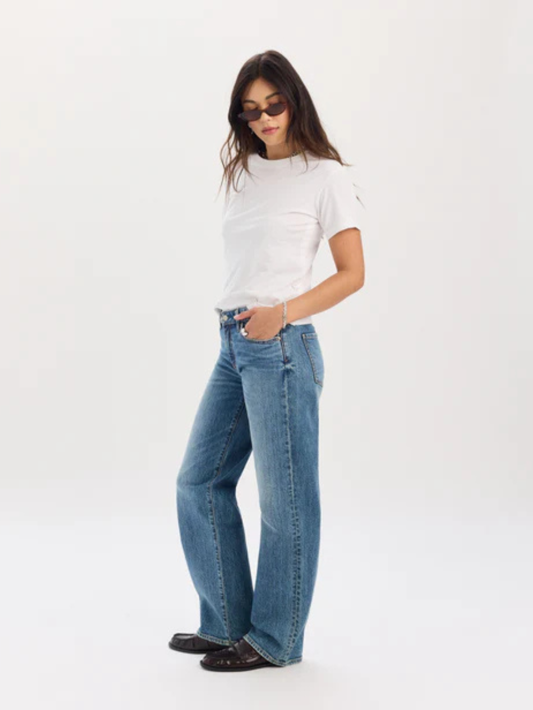 Daze Denim The Keeper low-rise straight-leg jeans on a model wearing a white tee.