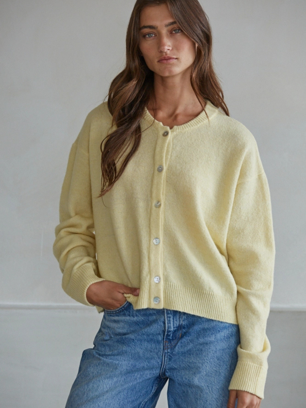 Sunday Soft Button-Front Knit Cardigan in pale yellow, relaxed cropped fit, crew neckline, pearl-button front.