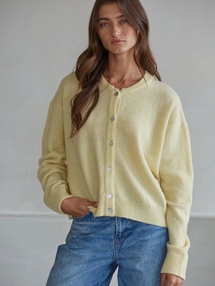 Sunday Soft Button-Front Knit Cardigan in pale yellow, relaxed cropped fit, crew neckline, pearl-button front.
