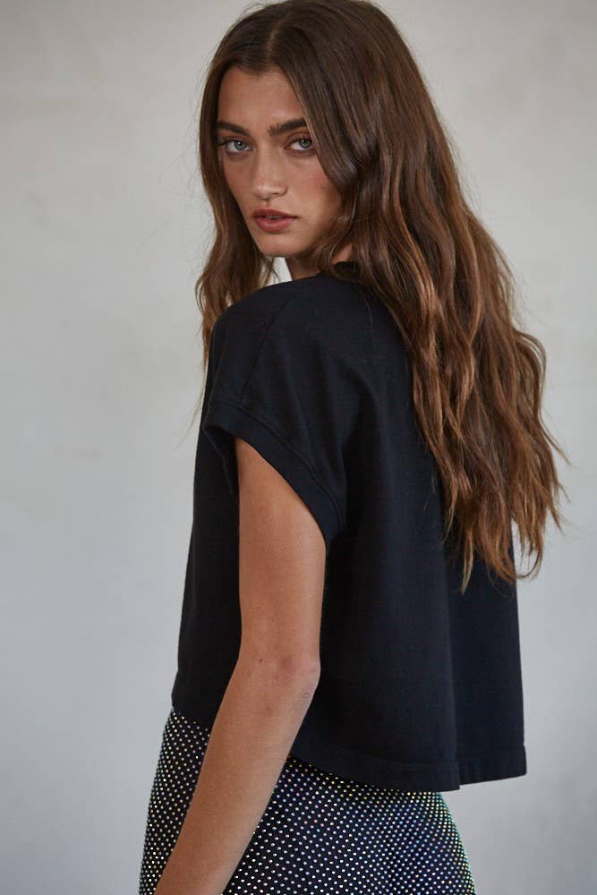 Stylish model showcasing the Bonnie Crew Crop Top, a soft cotton short sleeve design perfect for casual wear.