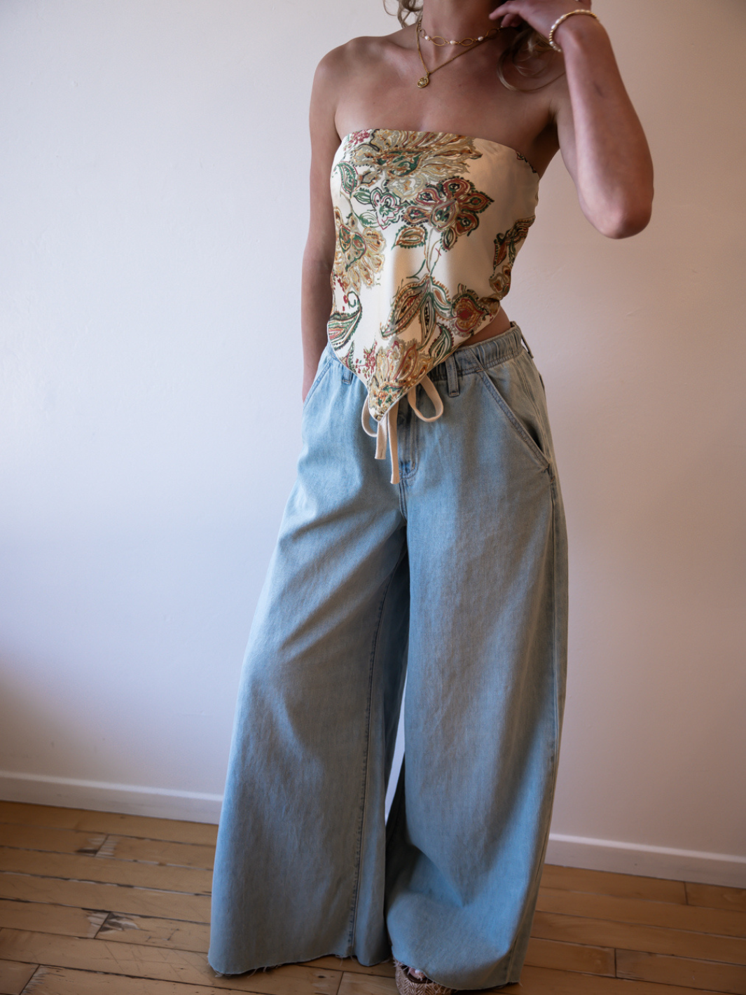 Daze Denim Cabana Wide Leg Pull-On Jeans in light wash worn with a floral bandeau top.