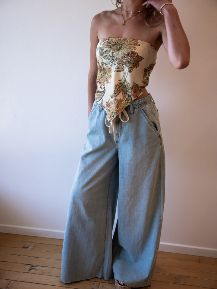 Daze Denim Cabana Wide Leg Pull-On Jeans in light wash worn with a floral bandeau top.