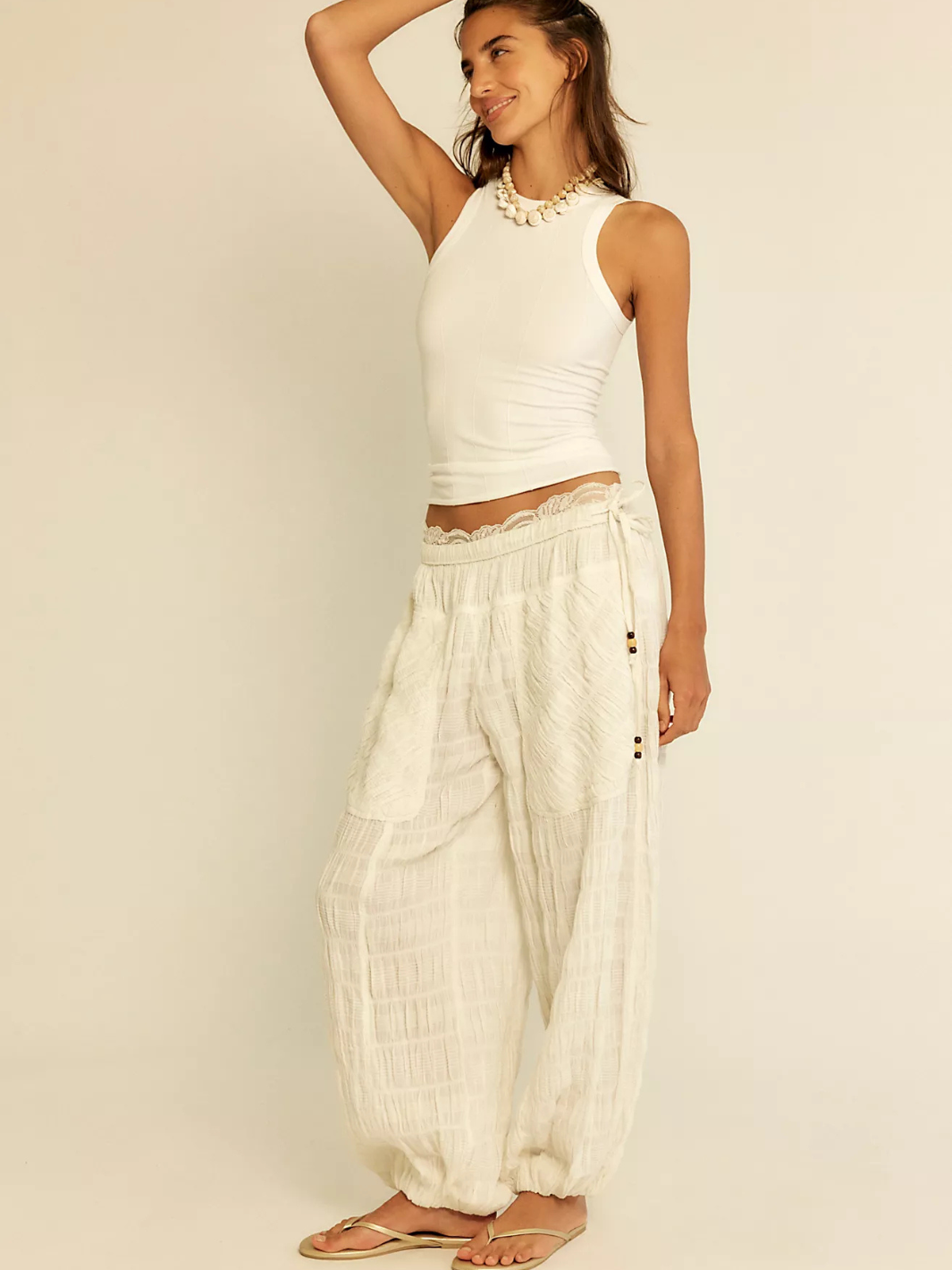 Free People So Soft Seamless Modal Tank—buttery-smooth with sculpted seams in a white fitted base layer.
