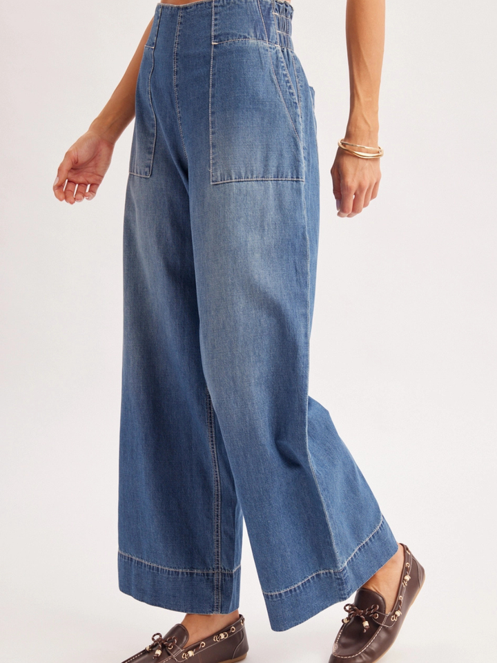 The Sailor Wide-Leg Denim Trouser in blue denim with relaxed wide-leg fit and patch pockets.