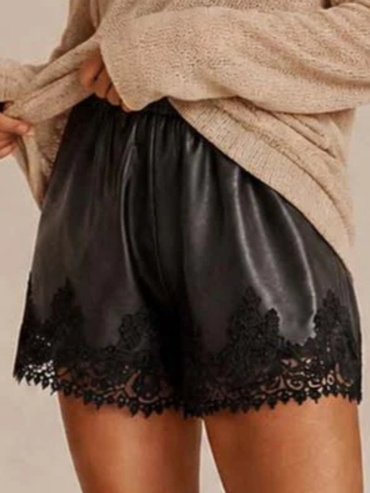 Capri Lace Edge Faux Leather Shorts — Black — full length styling shot with off-shoulder sweater and flat sandals — effortless day-to-night look