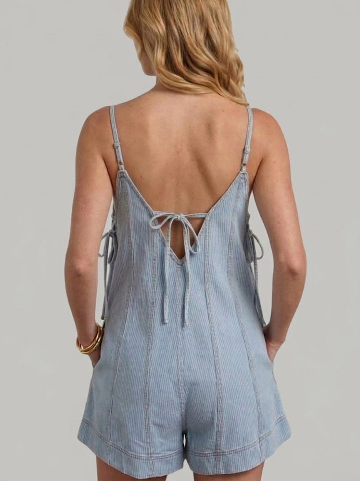 Sundaze Pin Stripe Denim Romper back view with tie-back straps, relaxed fit in light denim.