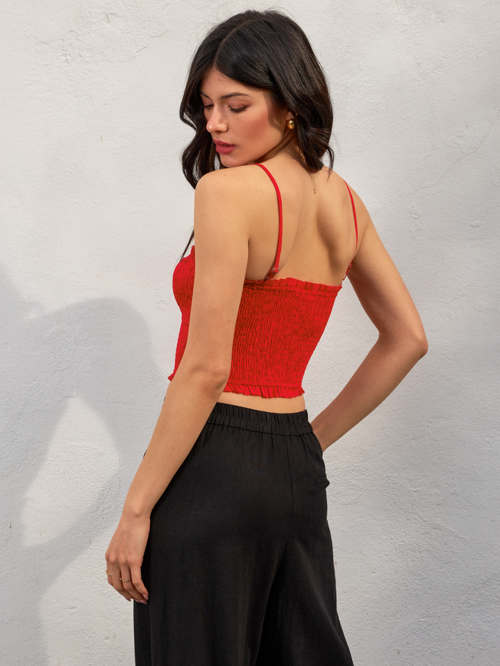 Stylishly modelled, the Amorette Smocked Sweetheart Crop Top features a ruffled hem and flattering sweetheart neckline.