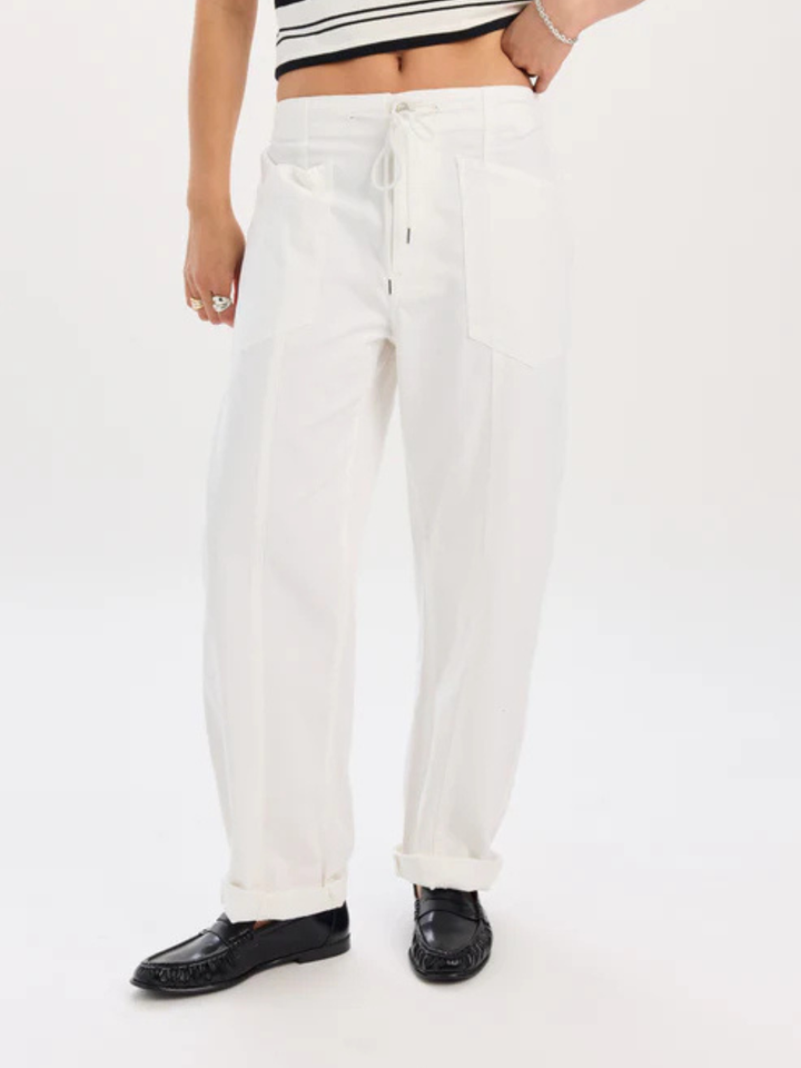 Daze Denim Villa Drawstring Barrel Leg Pant in white with a drawstring waist, relaxed fit, and rolled cuffs.