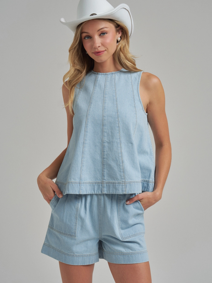 The Sutton Pinstripe Denim Tank Top, sleeveless with panel seams, paired with matching Sutton shorts.