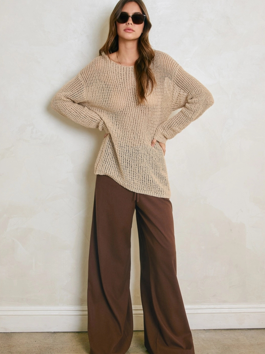 Sandcastle Open-Knit Pullover Sweater in Natural Taupe paired with brown wide-leg pants.