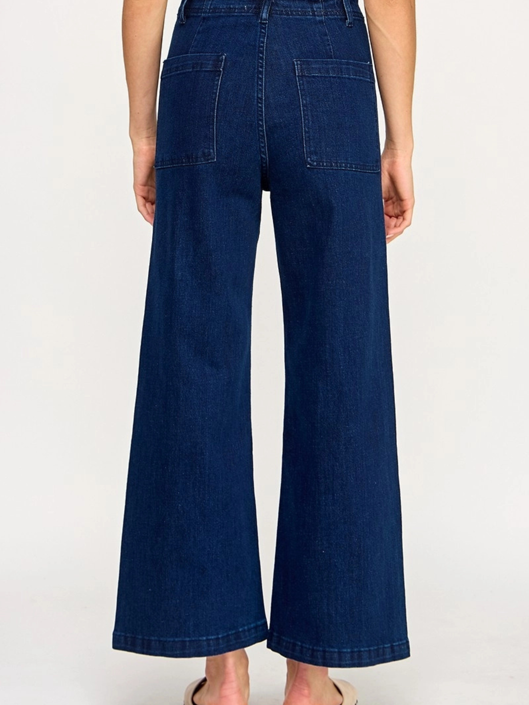 The Sundaze Dark Indigo High-Rise Wide-Leg Stretch Jeans with back pockets.