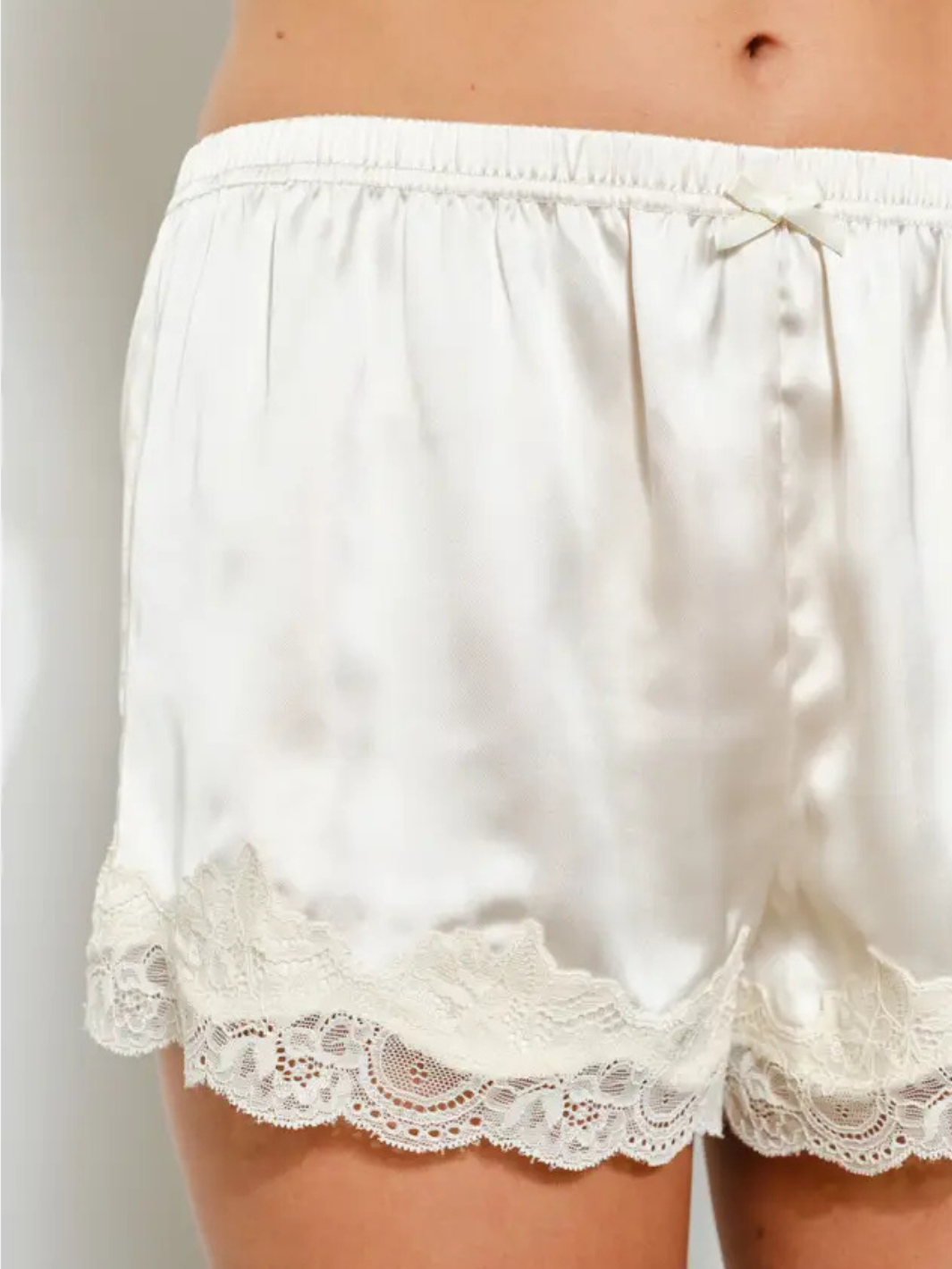 Midnight Muse Satin Shorts in ivory, back view, lace trim, scalloped hem, and elastic waist.
