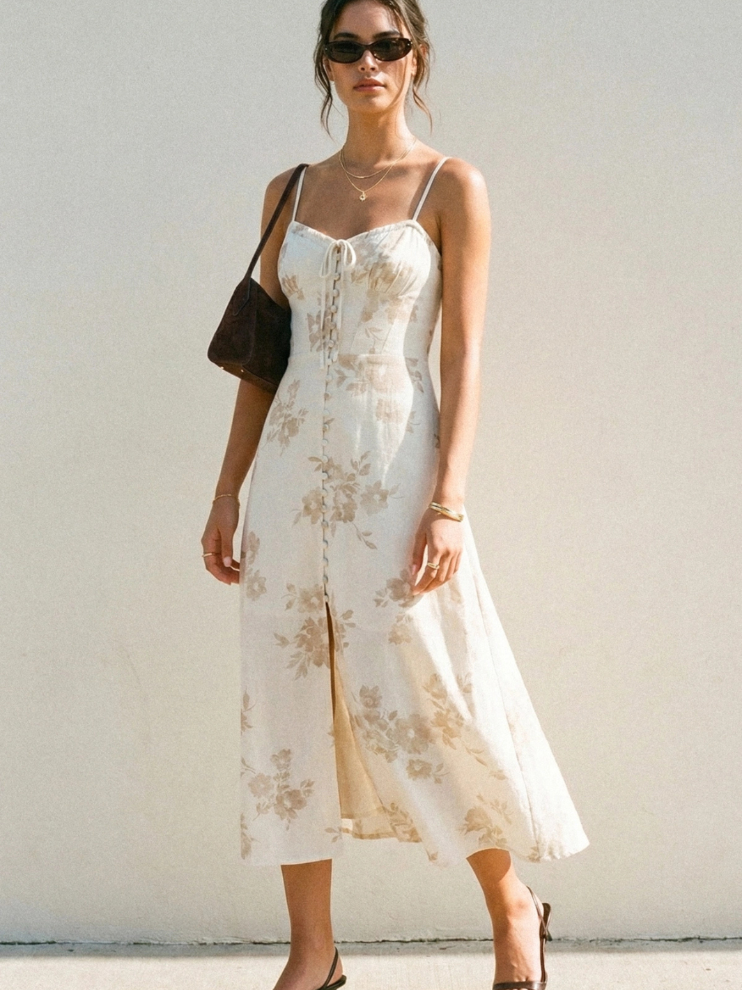 Model wearing The Garden Party Floral Corset Midi Dress: white floral print, corset bodice, A-line midi with slit.