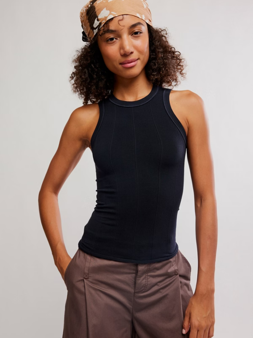Free People So Soft Seamless Modal Tank in black on model; buttery-smooth fabric with sculpted seam lines.