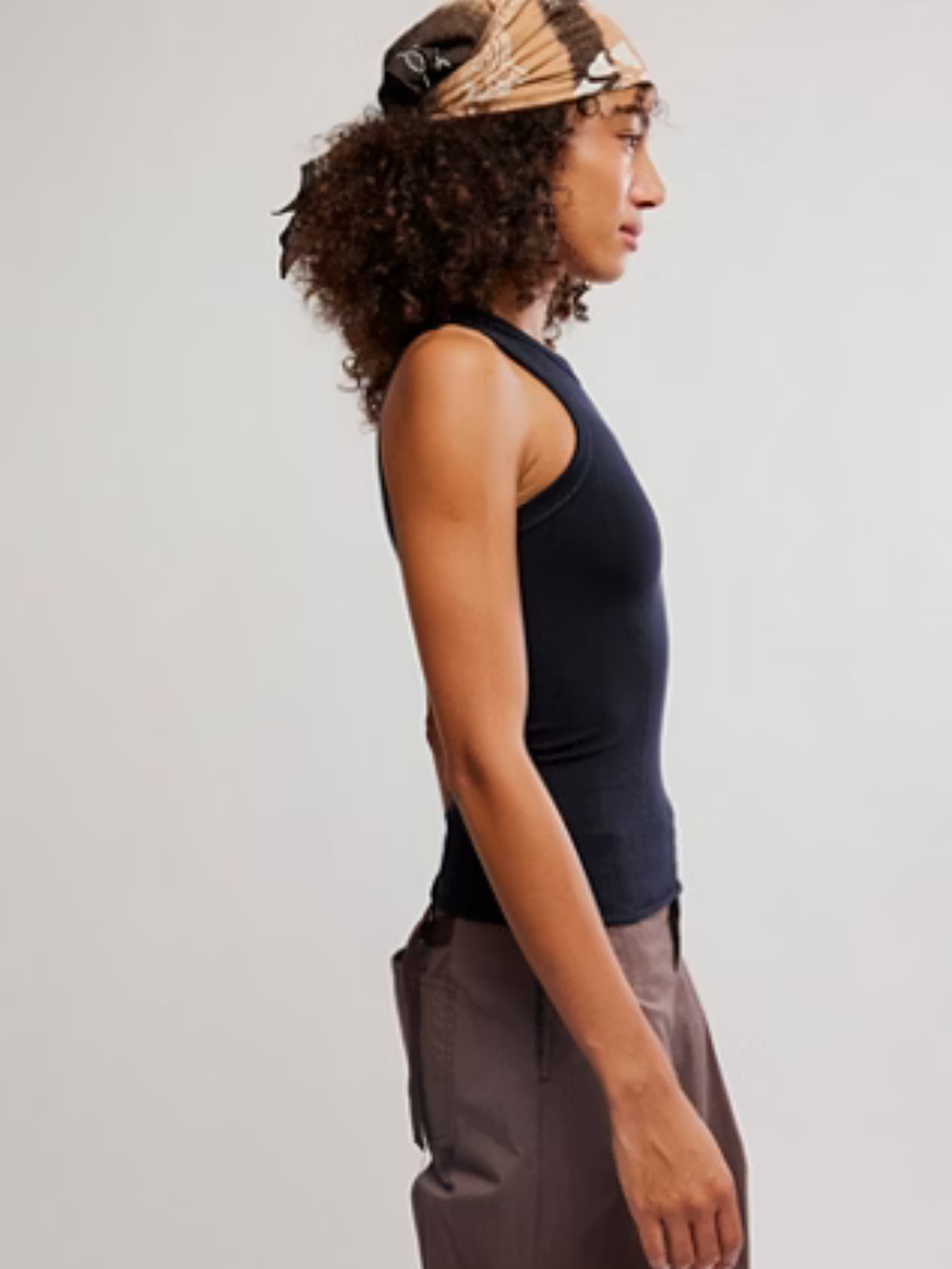 Side-profile of a woman wearing a black So Soft Seamless Modal Tank.