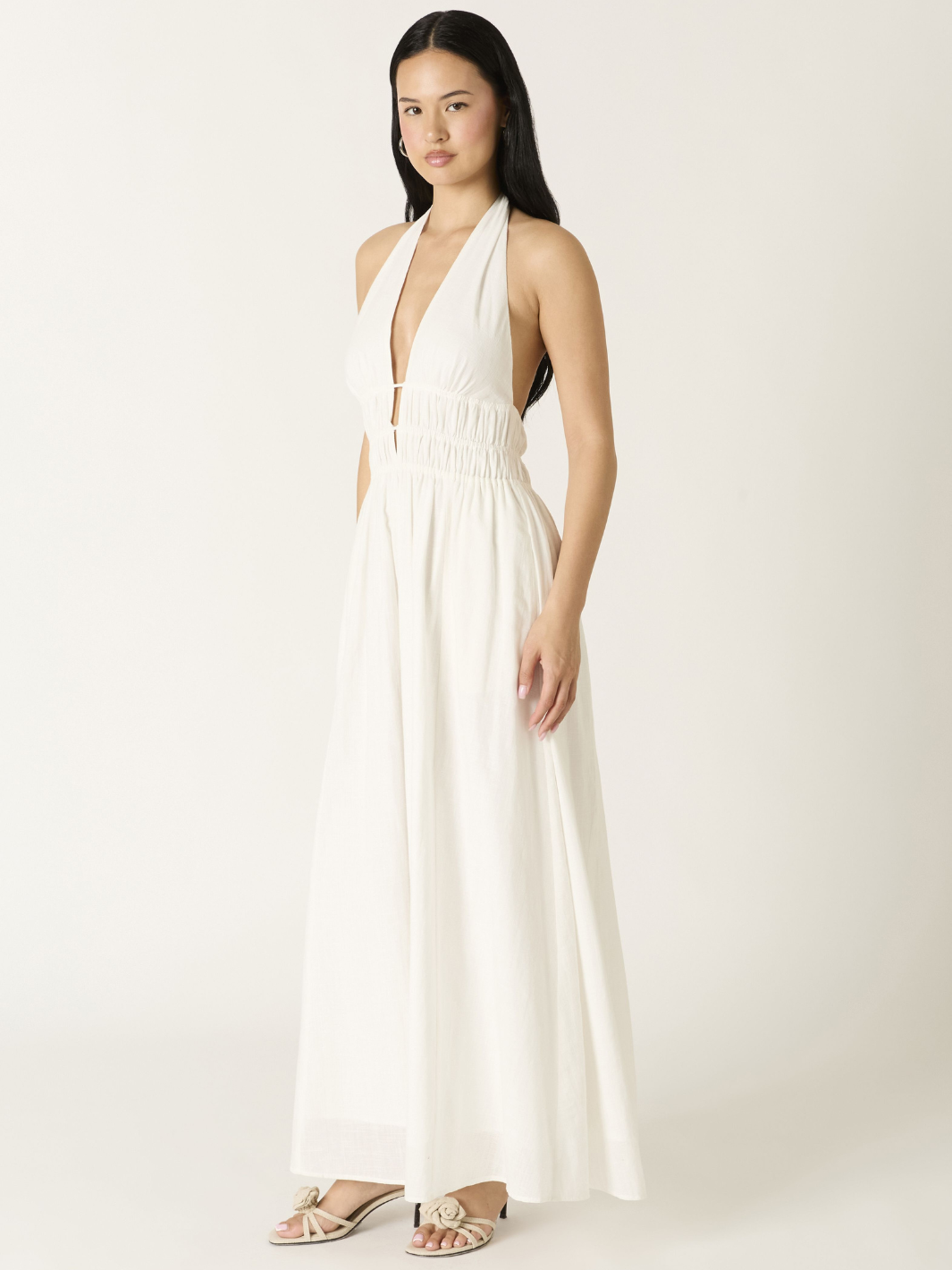 Soleil Plunge Halter Maxi Dress in white with a deep plunging neckline, smocked waist, and flowing A-line skirt.