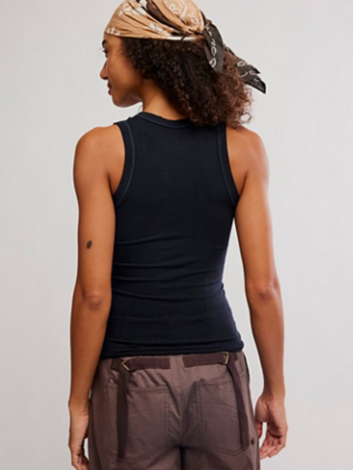 Back view of a model in a black Free People So Soft Seamless Modal Tank, sleek fitted base layer.
