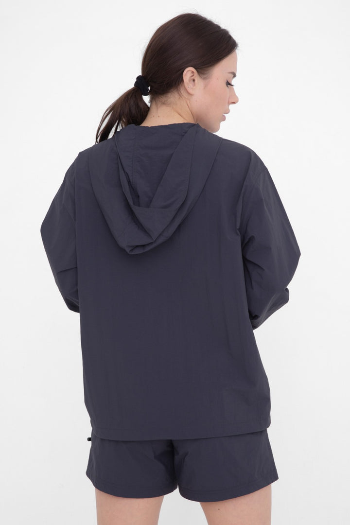 Rain or shine, our water resistant woven active hoodie is a must have. It features zippered hand pockets, a comfortable boyfriend fit, a snap placket at neckline, elastic at the sleeve cuffs, and an adjustable bungee at the hem.