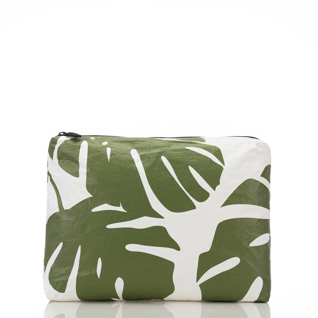 Aloha Collective Monstera - Seaweed travel pouch with bold green monstera leaves print.