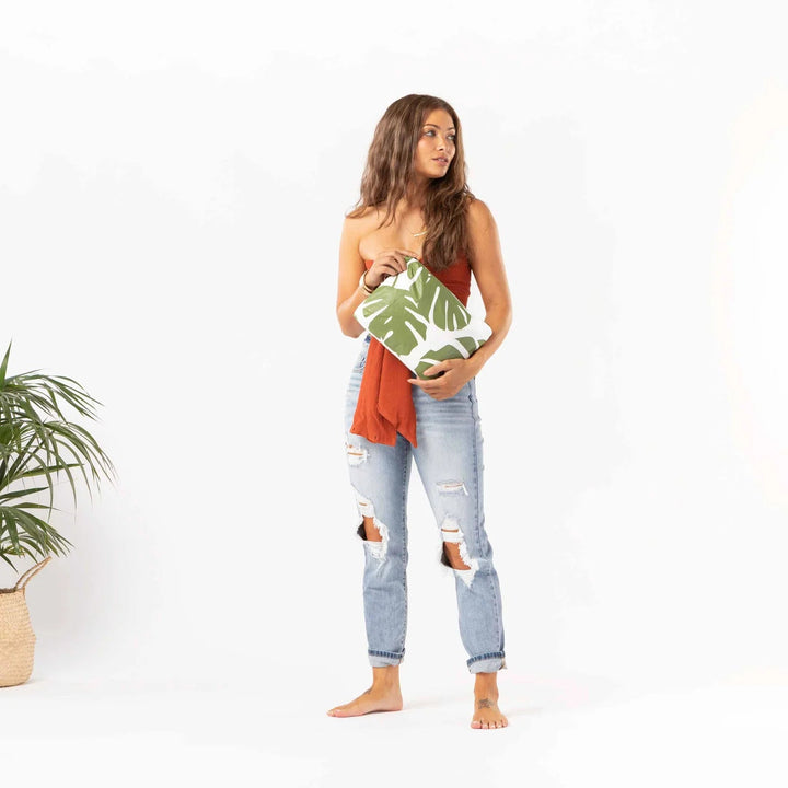 Aloha Collective Monstera Seaweed clutch with tropical monstera leaf print.