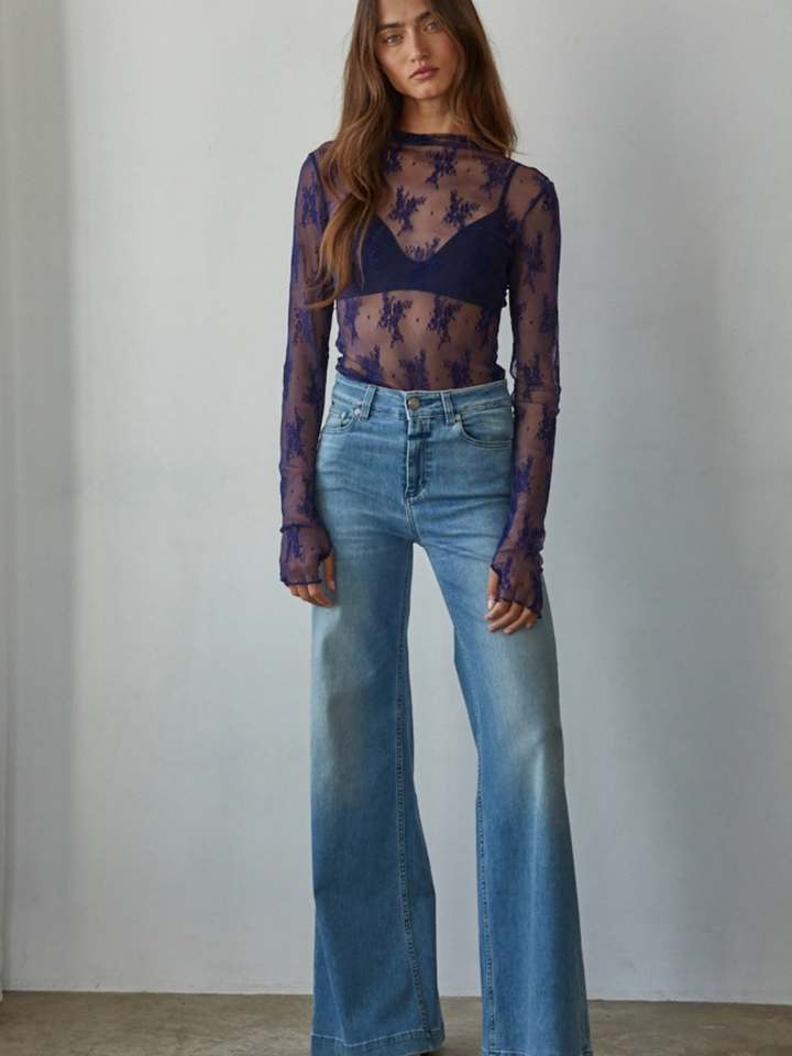 Aubrey Jacquard Lace Mock Neck Top: sheer navy lace, long sleeves, worn with a bralette and wide-leg jeans.