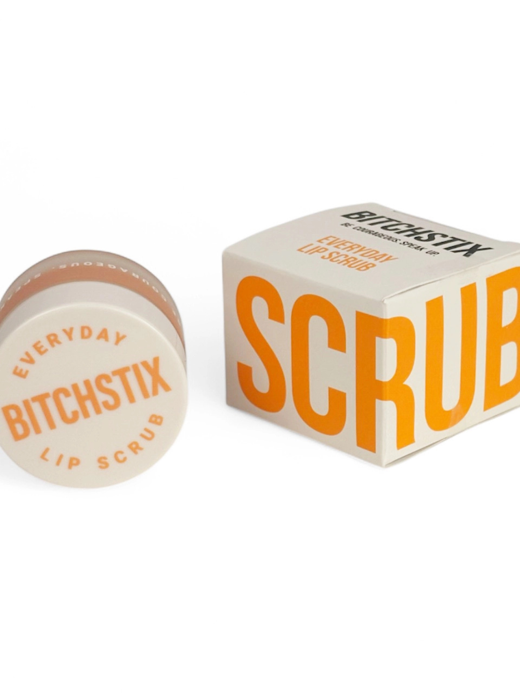 BITCHSTIX Everyday Lip Scrub in orange creamsicle scent, white jar beside bold orange SCRUB box.