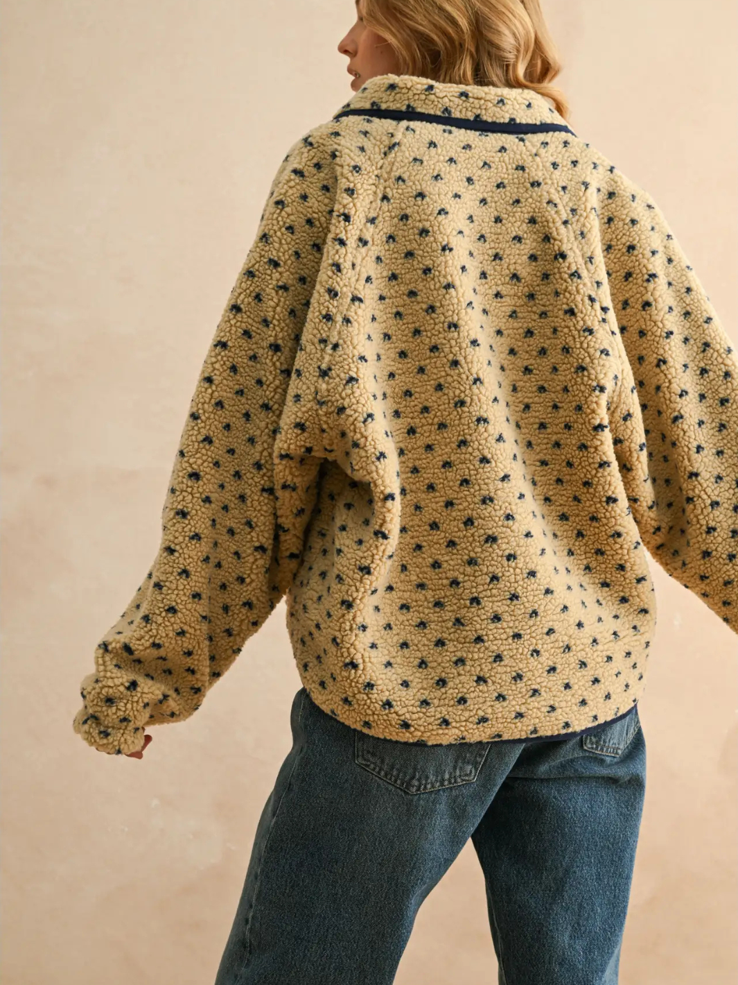 Back view of Canyon Bloom patterned sherpa fleece jacket with a playful floral dot pattern and contrast trim.