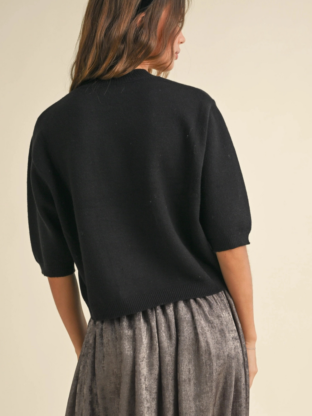 Cleo ribbed knit short sleeve sweater top in black, cropped hem with crew neckline and ribbed cuffs.