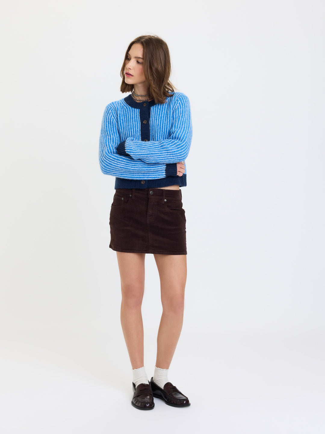 Daze Denim Fever Corduroy Micro Mini Skirt in Chocolate — front view styled with blue cardigan and loafers | Jayden P Boutique