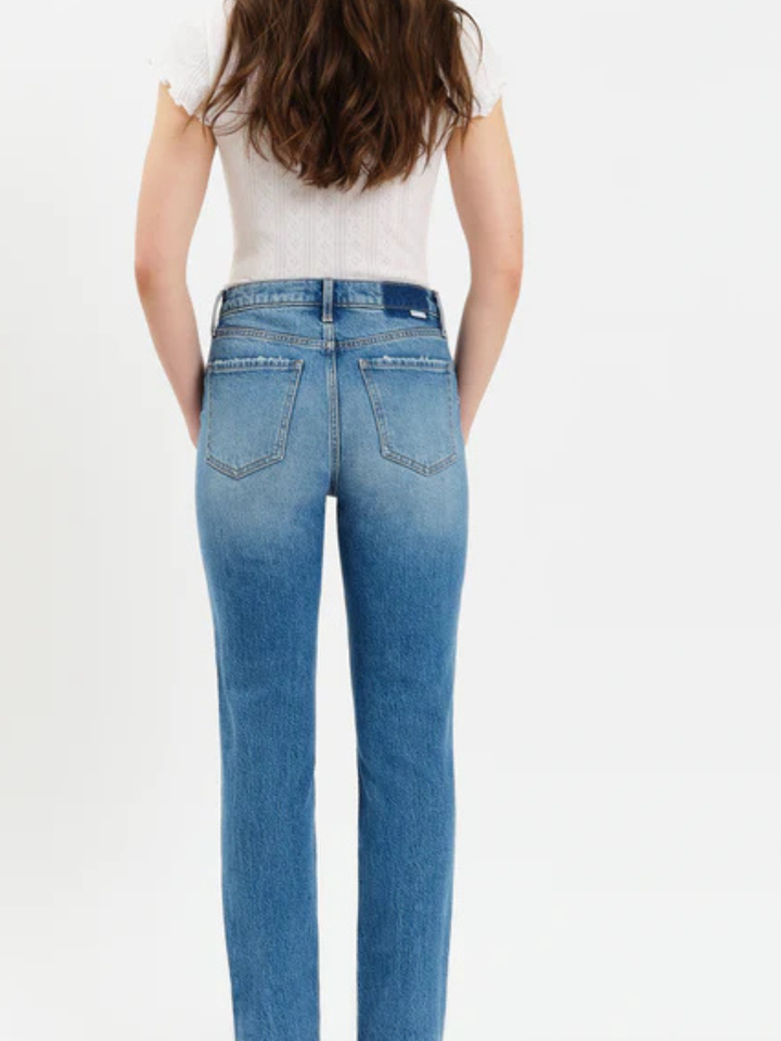 Back view of a woman in DAZE DENIM Smarty Pants High Rise Slim Straight jeans, Alter Ego wash.