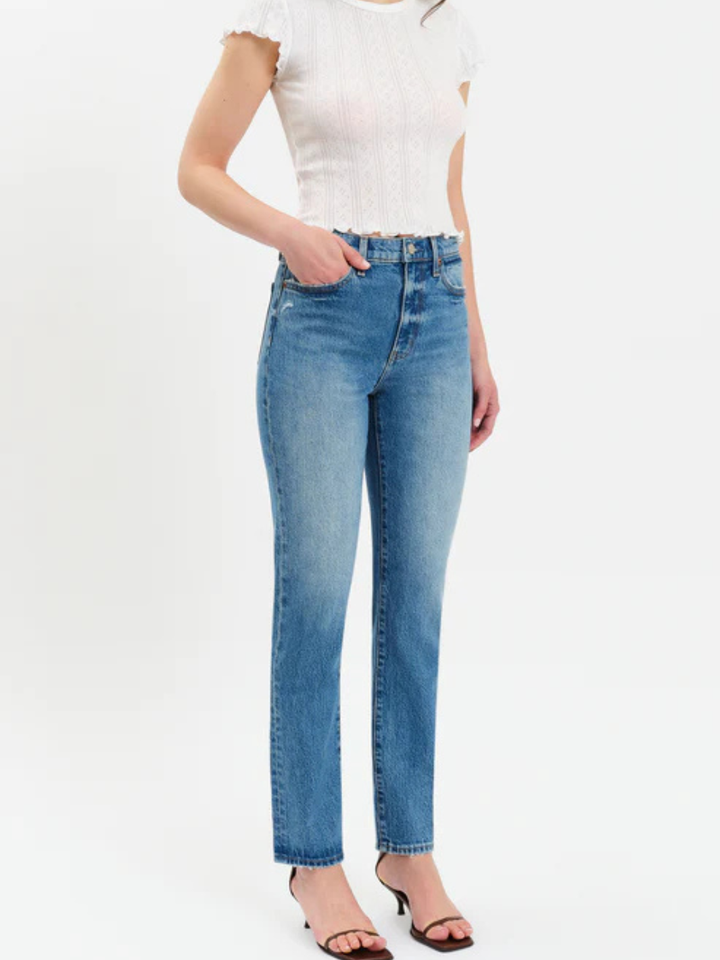 DAZE DENIM Smarty Pants High Rise Slim Straight in Alter Ego wash worn by model in white top.