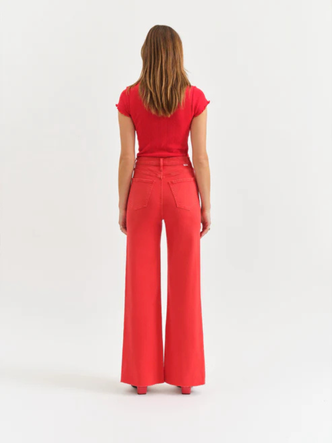 DAZE DENIM Far Out High Rise Wide Leg Jeans in red, back view on model.