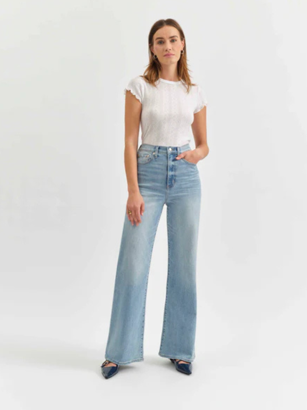 Stylish model showcasing DAZE DENIM - Farout High Rise Wide Leg Jeans in a light wash, perfect for any cool outfit.