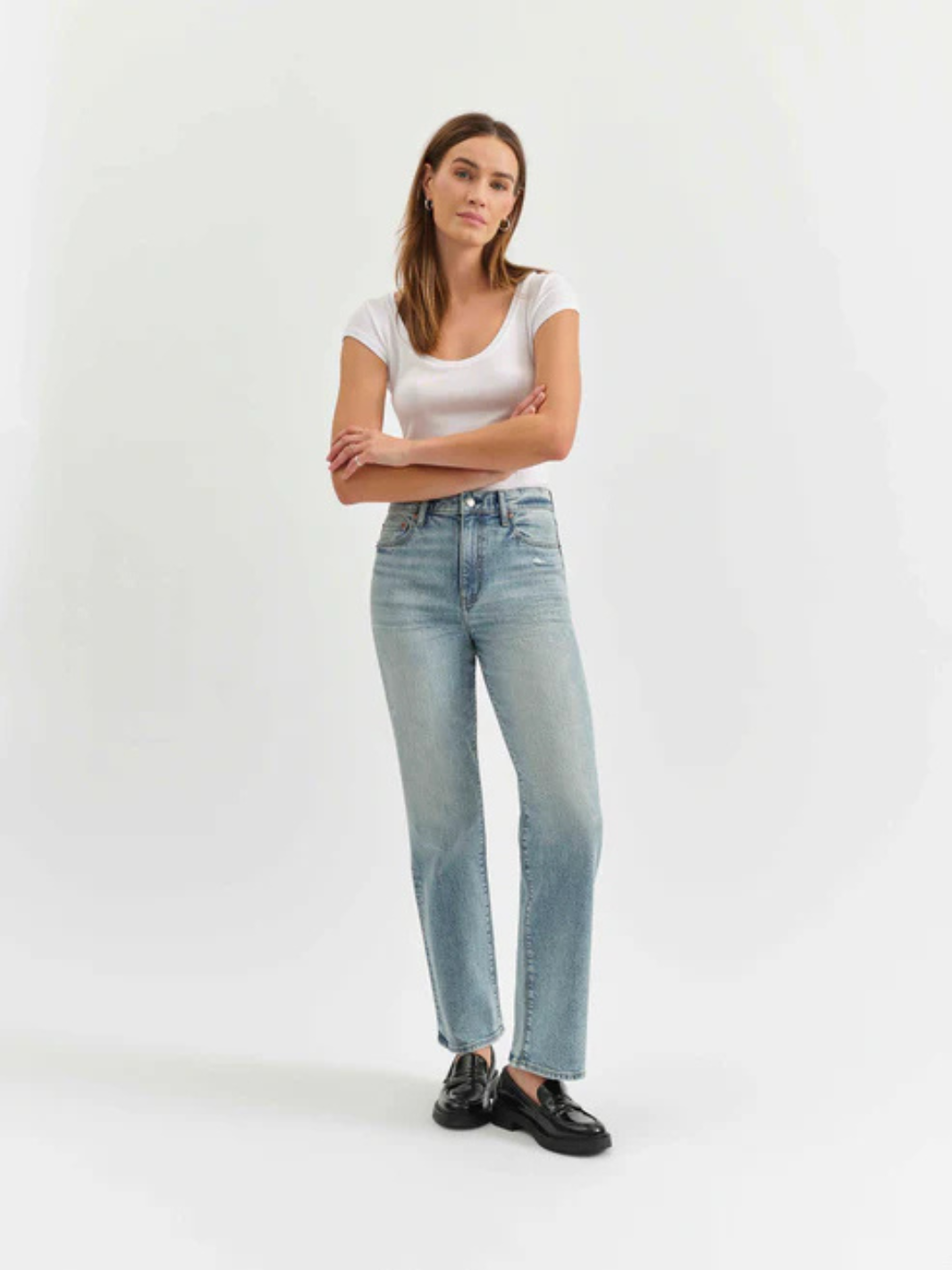 Stylish model showcasing DAZE DENIM - Sundaze High Rise Vintage Straight Jeans with a light wash and timeless silhouette.