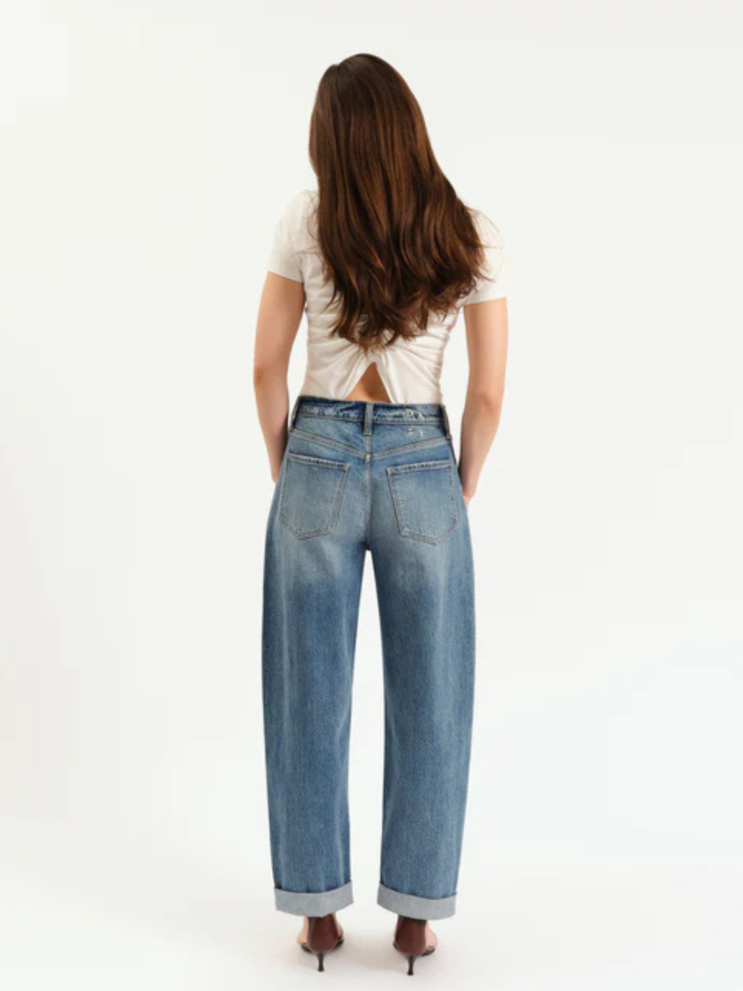 DAZE DENIM - Venice Barrel Leg jeans on model, high rise, pre-rolled cuff, back view.